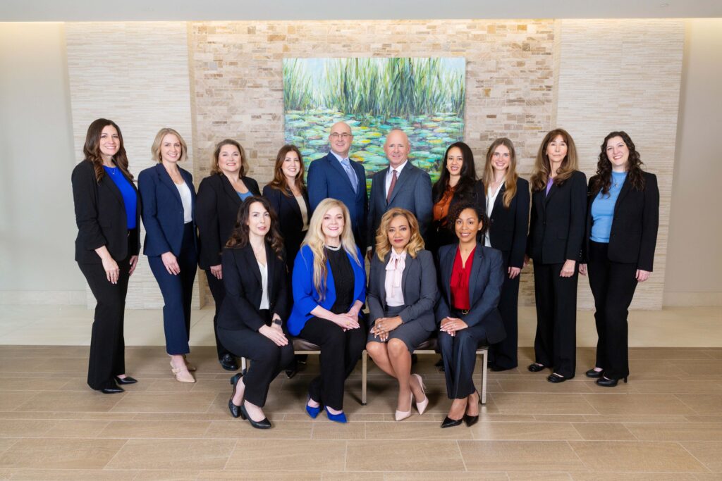 Attractive professionals posing in an office setting.