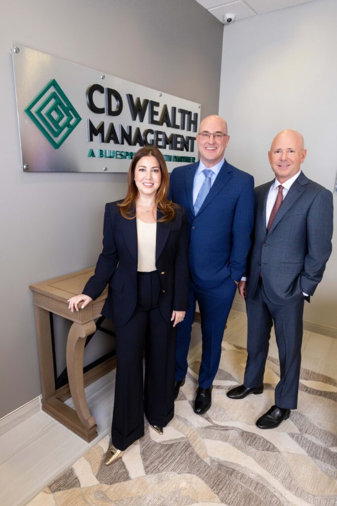 Attractive professionals posing in an office setting.