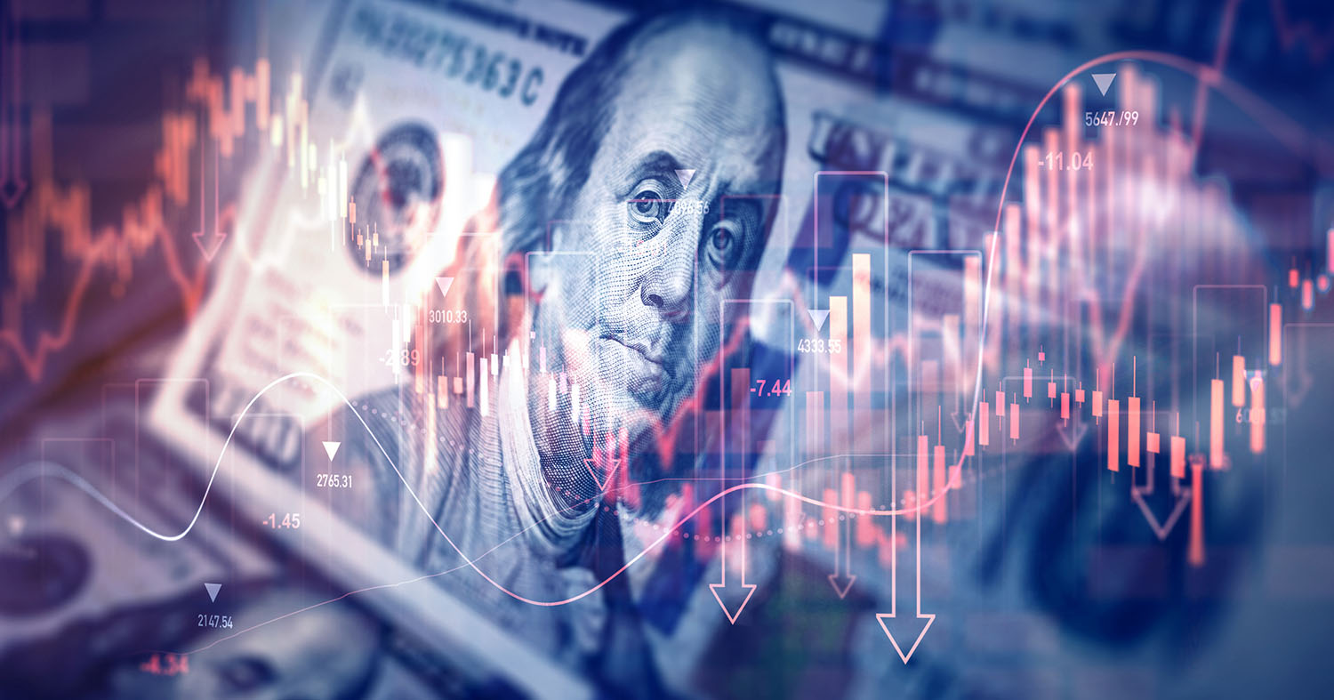 Stock market trading graph superimposed on a $100 bill.